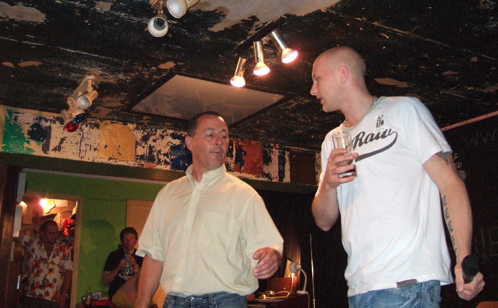 Comedian Nipper Thomas on stage at the Variety Club Notts with a member of the audience.